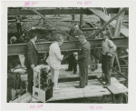 Radio Corporation of America (RCA) - Group standing in construction site with television