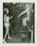 Railroads on Parade - Engineer on train and woman with shovel