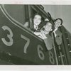 Railroads on Parade - Two men and woman looking out of train window