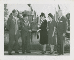 Railroads on Parade - One-millionth visitor to Budd Exhibit with group receiving plaque