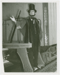 Railroads on Parade - Man dressed as Abraham Lincoln standing on train