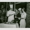 Restaurants - Grover Whalen and group carving meat at the opening of the Brass Rail
