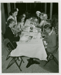 Restaurants - Group using chopsticks at table