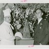Restaurants - Childs - George D. Strohmeyer (President of Childs Company) and chef with Trylon and Perisphere chicken croquette and mashed potatoes