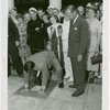 Restaurants - Schaefer Brewing Company - Man making handprint in pavement to celebrate one millionth glass of beer celebration