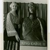 Romania Participation - Woman in traditional dress with bust of King Carol II