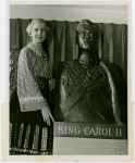 Romania Participation - Woman in traditional dress with bust of King Carol II