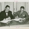 Siam official and Grover Whalen signing contracts