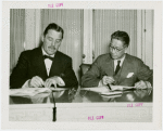Siam official and Grover Whalen signing contracts