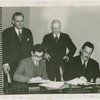 Syrian officials and Grover Whalen signing contract