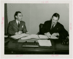 Southern Rhodesia official and Grover Whalen signing contract