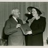 Kate Smith and Harvey Gibson holding plaque