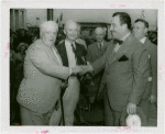 Special Days - Grover Whalen and founder shake hands at Lions Day