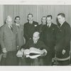 Special Days - Governors' Day - Governor signing book as group looks on