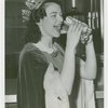 Special Days - Hot Dog Day - Winner of Most Beautiful Waitress contest eating hot dog