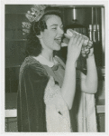Special Days - Hot Dog Day - Winner of Most Beautiful Waitress contest eating hot dog