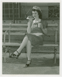 Special Days - Hot Dog Day - Winner of Most Beautiful Waitress contest eating hot dog
