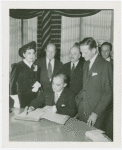 Special Days - Inventors' Day - Man signing guestbook book