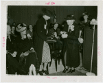 Special Days - Rural Women's Day - Woman presenting Eleanor Roosevelt with orchids