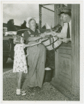 Special Weeks - Farm Week - Man trading corn for admission tickets