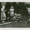 Special Weeks - Tulip Week - Grover Whalen with costumed youth planting bulbs