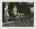 Special Weeks - Tulip Week - Grover Whalen with costumed youth planting bulbs