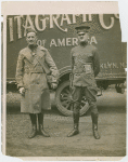 Sports - Two men in uniforms in front of [V]itagraph Co. truck.