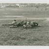 Sports - Two men on ground with motorcycle
