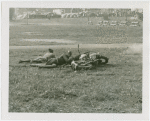 Sports - Two men on ground with motorcycle