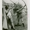 Sports - Archery - Two woman in costumes aiming bows