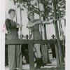 Sports - Archery - Woman in costume and man with bows and arrows