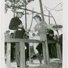 Sports - Archery - Man in uniform and woman in costume with bows and arrows