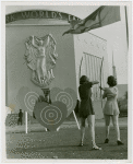 Sports - Archery - Two women aiming at heart shaped targets and man