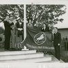 Sports - Banner - Group of men and women raising United States Polo Association flag