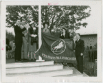 Sports - Banner - Group of men and women raising United States Polo Association flag