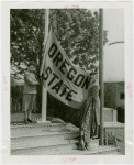 Sports - Banner - Two women raising Oregon State flag