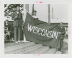 Sports - Banner - Three men raising Wisconsin flag