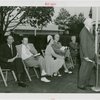 Sports - Banner - Man giving speech while group of people listen