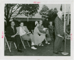 Sports - Banner - Man giving speech while group of people listen