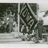 Sports - Banner - Group of men and women raising Iowa flag