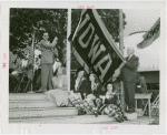 Sports - Banner - Group of men and women raising Iowa flag