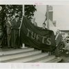 Sports - Banner - Group of men raising Tufts flag