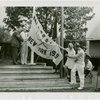 Sports - Banner - Three men and woman raising tennis flag