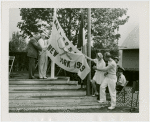 Sports - Banner - Three men and woman raising tennis flag