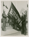 Sports - Banner - Tuss McLaughry and Ralph Palmer raising Brown University flag