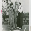 Sports - Baseball - Leo Durocher at microphone with boy scout and other man