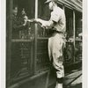 Sports - Baseball - Baseball player passing autograph to boy through fence