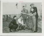 Sports - Baseball - Doc Prothro watching while Chuck Klein teaches boys how to bat