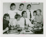 Sports - Baseball - Lou Gehrig signing baseball card with group of boys