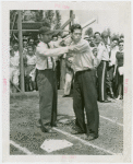 Sports - Baseball - Morrie Arnovich teaching boy how to bat